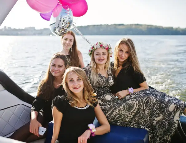 Girls having fun at yacht on hen party.